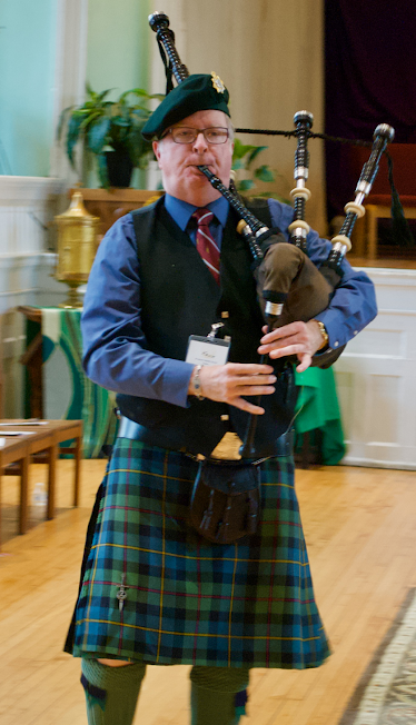 A photo of Kevin Chapman playing the bagpipes