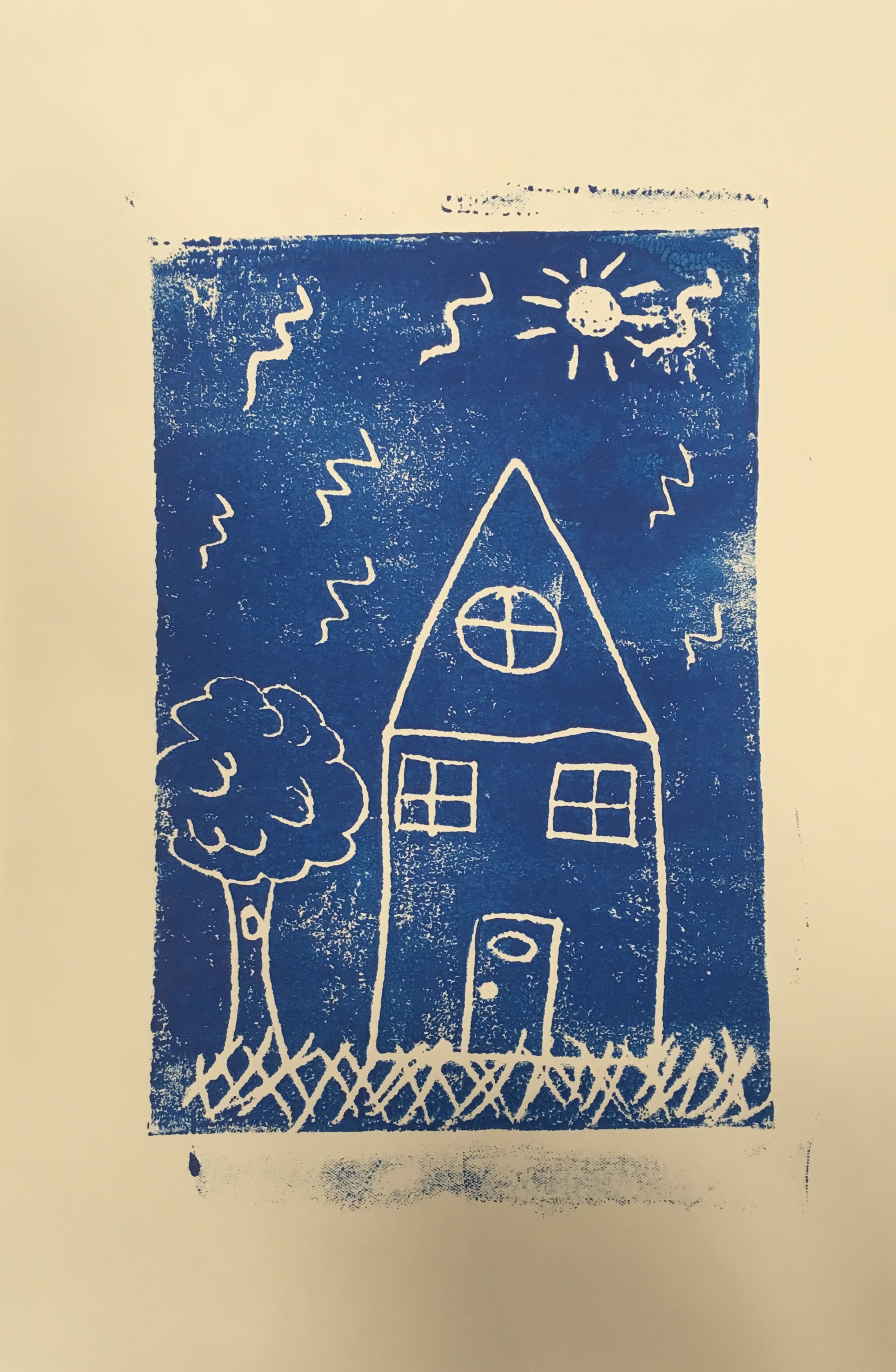 Printmaking image of a house with a tree in blue ink