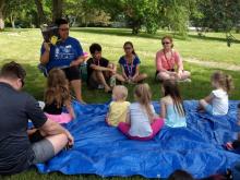 Ms. Janeé reads during a special "Sunshine Storytime" last summer.