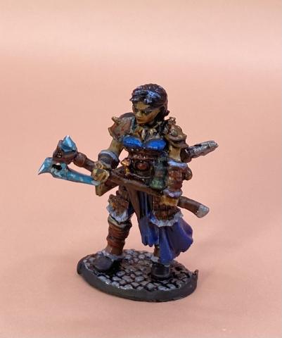 a painted miniature of a female warrior